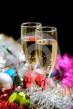 Cristmas glasses with champagne on cristmas decoration background