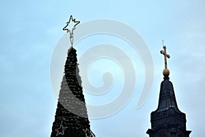 Cristmas tree with a church in the background