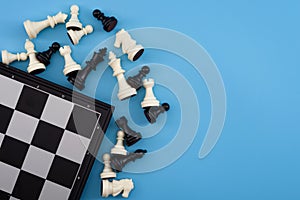 Critical thinking, winning chess tournament and mind game concept with chessboard and figures isolated on blue background with