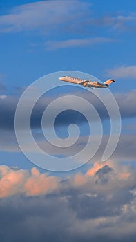 CRJ 100 take off on sunset