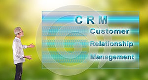 A crm concept explained by a businessman on a wall screen