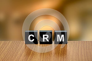 CRM or Customer relationship management on black block