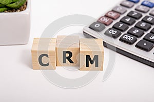 CRM, Customer Relationship Management, loyalty program, repeat purchase frequency concept, cube wooden block with alphabet combine