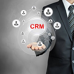 CRM (Customer Relationship Management) sign shown by a businessman