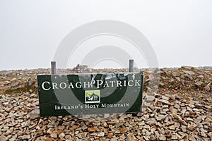 Croagh Patrick, Ireland - 07.15.2020: Sign Croagh Patrick Ireland holy mountain, white cloudy sky in the background