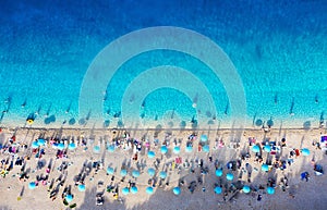 Croatia. Aerial view on the beach with umbrellas. Beach and azure water. Summer background