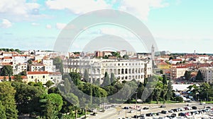 Croatia, city of Pula, ancient Roman arena, historic amphitheater and old town center fron drone