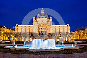 Croatia, city of Zagreb, art pavilion and fountain in the night