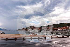 Croatia.Cloudy rainy summer day.View of the gulf of the Adriatic Sea, city, low mountains.