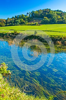 Croatia, countryside landscape, river Dobra and old fortress in Novigrad