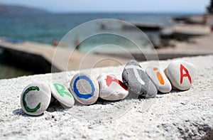 Croatia inscription on the stones with adriatic sea in the background