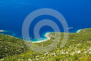 Croatia, island of Cres on Adriatic sea, amazing panoramic view of azure lagoon and beach under Lubenice town
