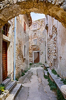 Croatia Istria. Ancient abandoned medieval town Plomin. Arch