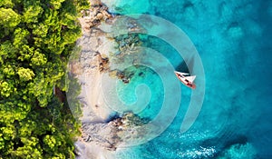 Croatia. Panoramic coast and yacht as a background from top view. Turquoise water background from top view. Beach and waves.