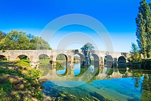 Croatia, river Dobra and old stone bridge in Novigrad