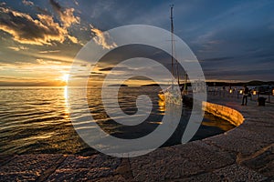 Croatia, Rovinj - June 2019. Sunset on the embankment of the Mediterranean Sea in the old town of Rovinj