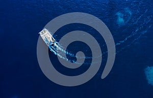 Croatia. Summer. Aerial view of floating yacht on blue Adriatic sea at sunny day.  Sail boat on sea surface. Seascape from drone.