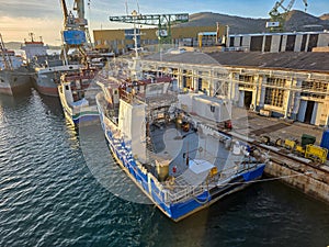 Croatia, Trogir, November 1st 2025 - Moan Marin workboat alongside at a shipyard undergoing extensive refit