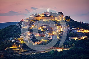 Croatia. Vintage Motovun walled city at knoll. photo