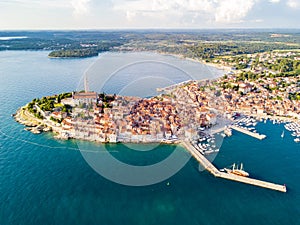 Croatian town of Rovinj on a shore of blue azure turquoise Adriatic Sea, lagoons of Istrian peninsula, Croatia. High bell tower.