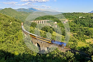 Croatian train with blue diesel locomotive