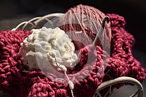 Crochet in basket at light place photo
