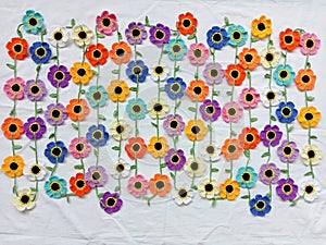 Crochet flower multicoloured necklace daisy background texture