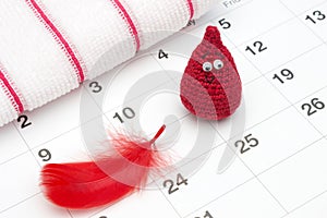 Crochet funny blood drop and a calendar. Woman critical days, gynecological menstruation cycle.