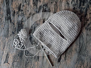 Crochet hat balaclava from gray yarn top view