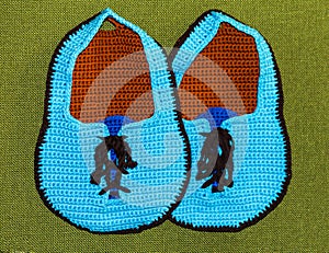 Crochet potholder, blue carpet slippers