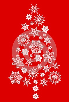 Crochet snowflakes in shape of Christmas tree isolated on red. New Year or Christmas background. Greeting card. Vertical