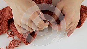 Crochet woolen threads.Dissolves the associated pattern.Unravels double crochets