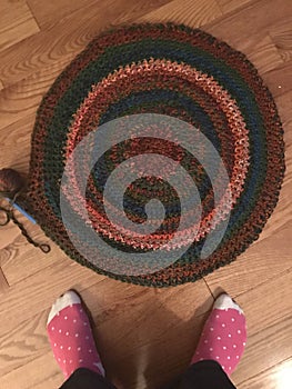 Crocheted circle rug with feet