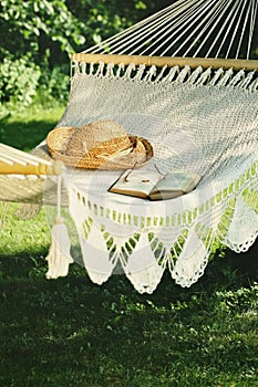 Crocheted hammock with hat and book