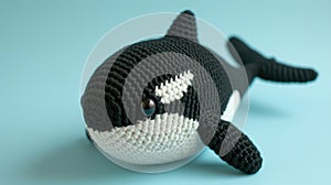 Crocheted killerwhale toy vibrant backdrop, handcrafted and adorable, Ai Generated
