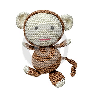 Crocheted monkey toy isolated