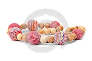 Crocheted and wooden pink beads isolated