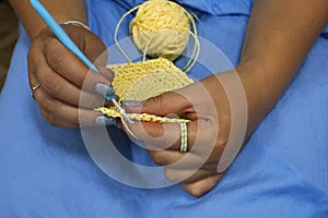Crocheting yellow raffia
