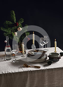 crockery and candles for christmas table serving