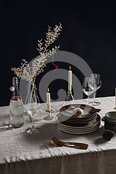 crockery and candles for christmas table serving