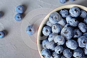 Crockery with juicy and fresh blueberries