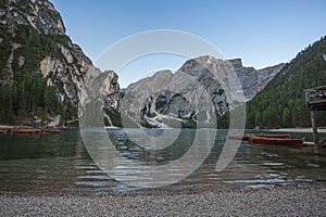 Croda del Becco peak and forest over the Braies lake at sunset