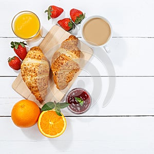Croissant breakfast croissants orange juice coffee food wooden board from above copyspace copy space square