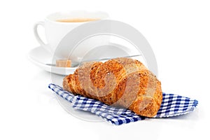 Croissant with caffee cup.