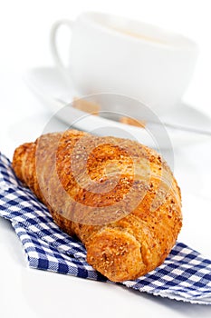 Croissant with caffee cup. photo