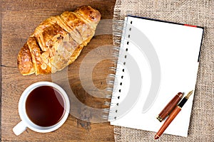 Croissant cup coffee white book pen