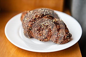 Croissant with Everything Bagel Seasoning on a White Plate