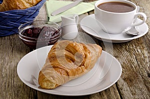 Croissant, a French breakfast on a plate