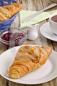 Croissant, a French breakfast on a plate