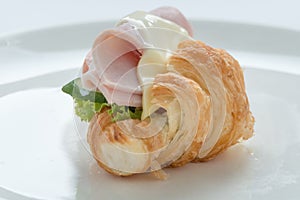 Croissant ham cheese sandwich.